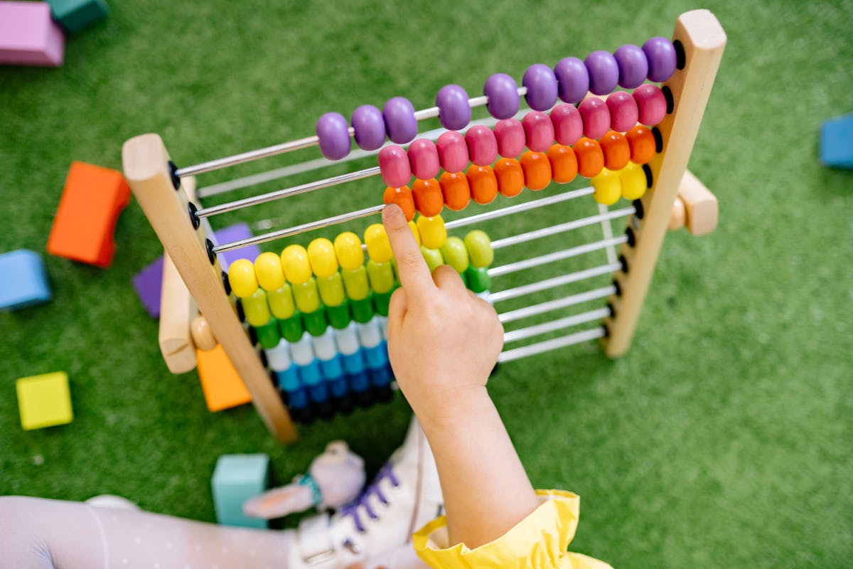 Child learning with colorful abacus
