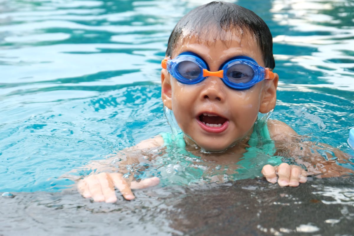 Child swimming in therapeutic pool