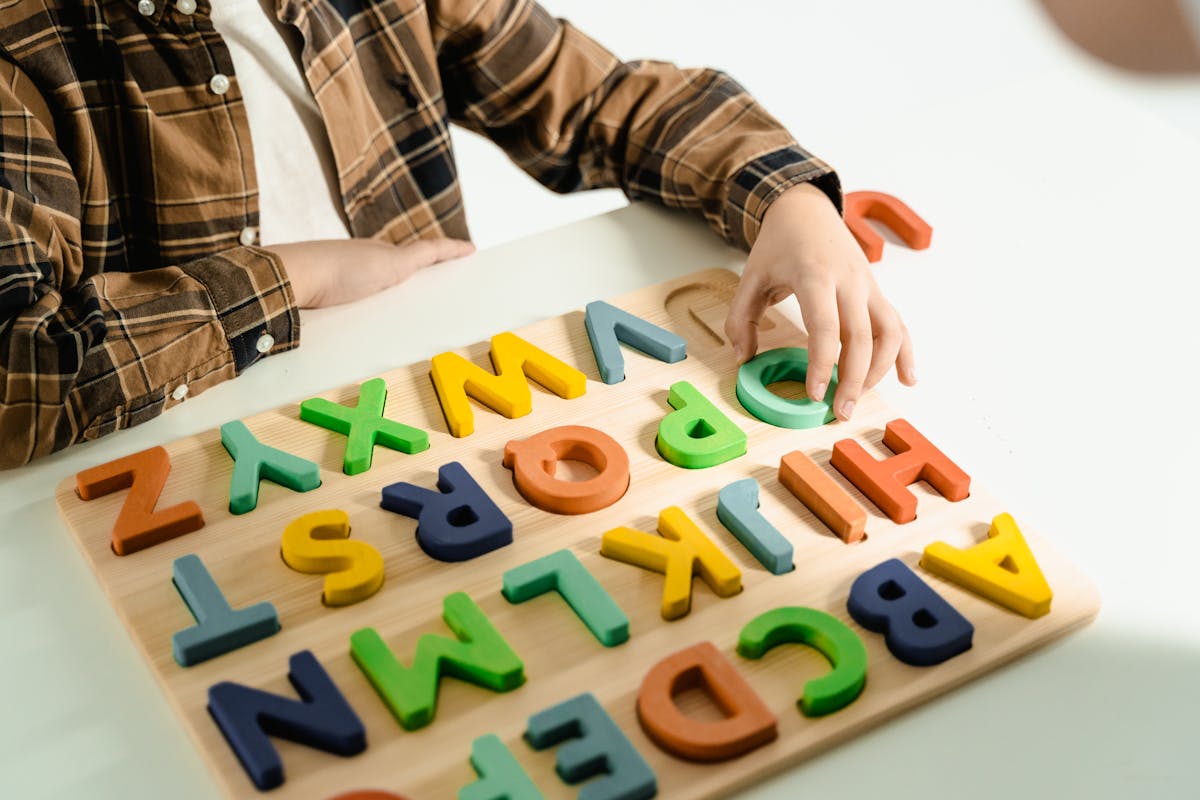 Child learning with colorful alphabet letters